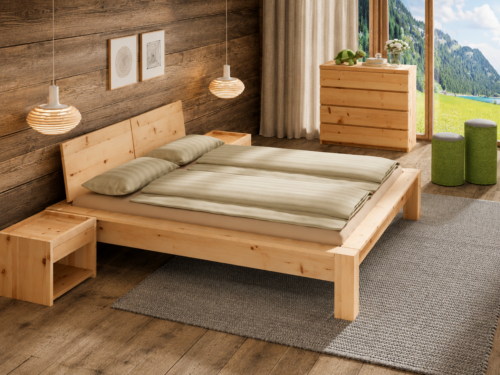 Zirbenbett Modell 5 in einem Schlafzimmer mit Holzwand